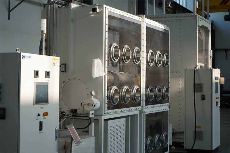 A large-scale industrial glovebox system by CHJT, featuring a multi-port processing chamber connected to a main control panel.